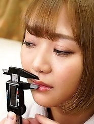 Nail polish in a small purple bottle.